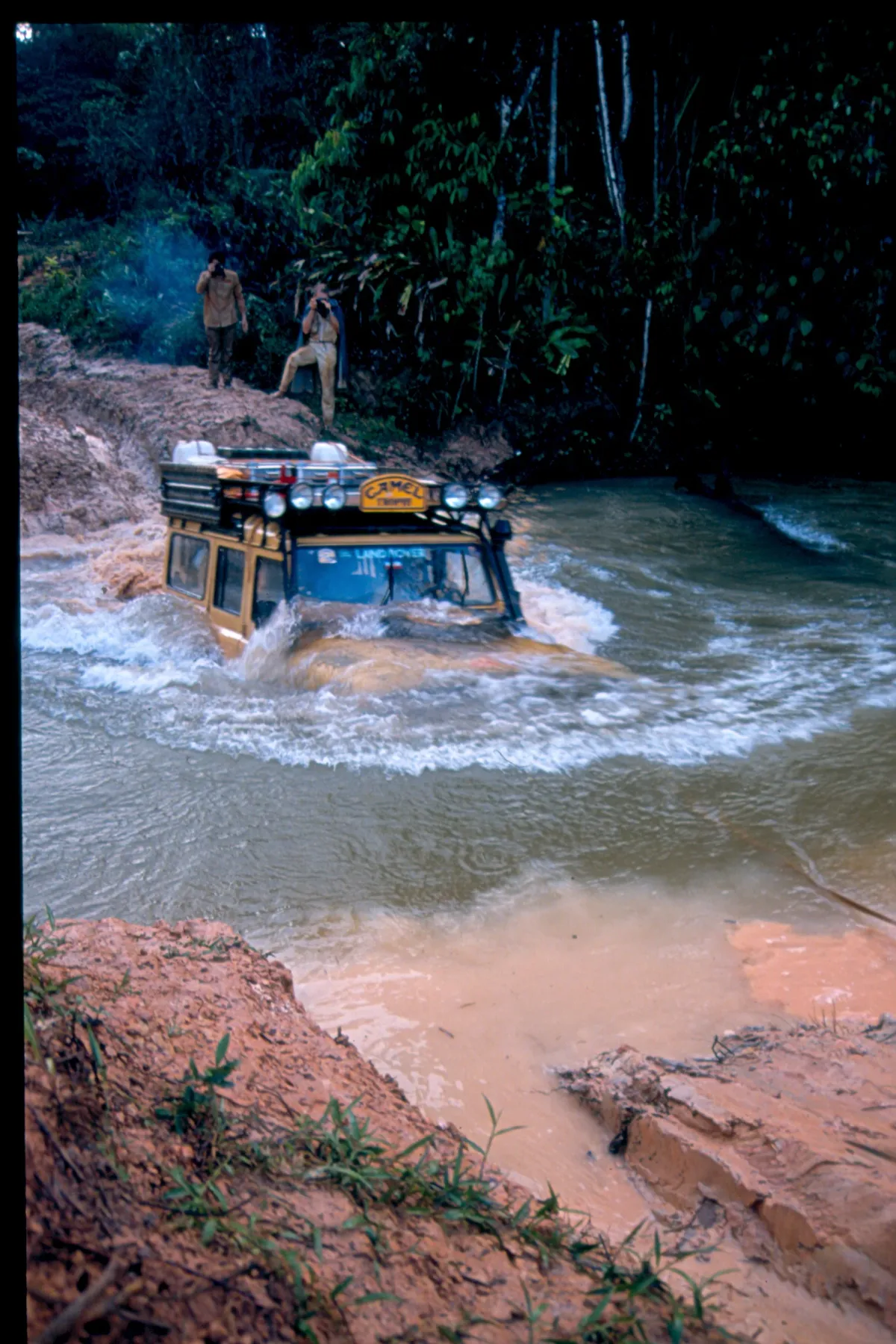 A Camel Trophy vehicle fording a river
