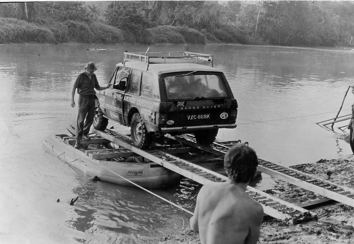 A Range Rover fording a river in the Darién Gap
